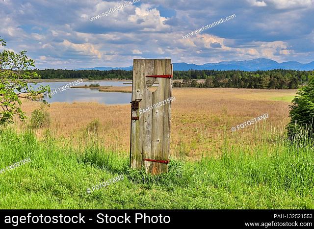 Iffeldorf, Germany May 19th, 2020: Impressions Osterseen - 2020 Gartensee, near Seeshaupt, Landkeis Weilheim / Schongau, with single door / door on a wide field...