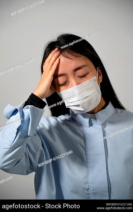 Young woman wearing protective mask