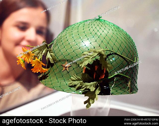 PRODUCTION - 12 June 2023, Baden-Württemberg, Karlsruhe: The flowered plastic helmet of Green Party politician Petra Kelly from the Mutlang ""celebrity...