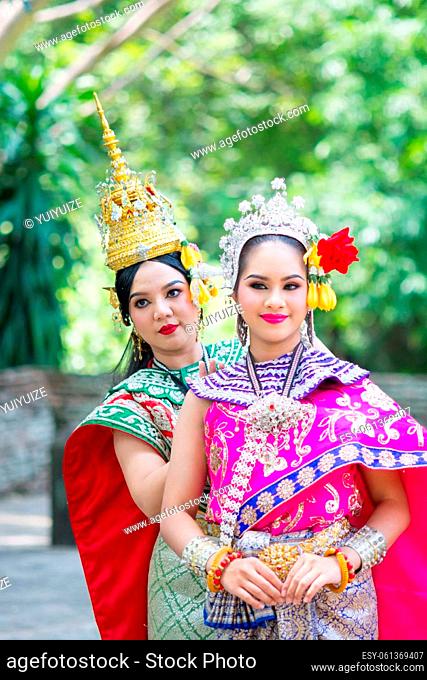 Asian women wearing typical, traditional Thai Dress. National costume in different colors