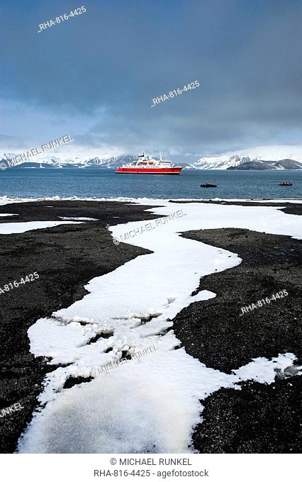 Cruise ship anchoring in the volcanic crater of Deception Island, South Shetland Islands, Antarctica, Polar Regions