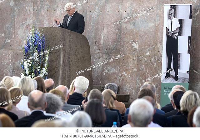 01 July 2018, Germany, Frankfurt am Main: A photograph of Fritz Bauer (R) in Paulskirche (St. Paul's Church) as German President Frank-Walter Steinmeier (l)...