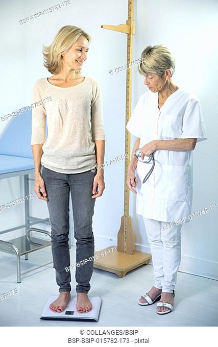 Woman being weighed at the doctor's