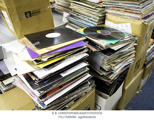 Used vinyl records stacked up for resale