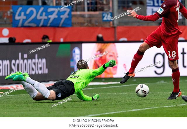 Bochum's goalkeeper Manuel Riemann (L) also blocks the follow-up shot by Kaiserslautern's Christoph Moritz during the German 2nd Bundesliga soccer match between...