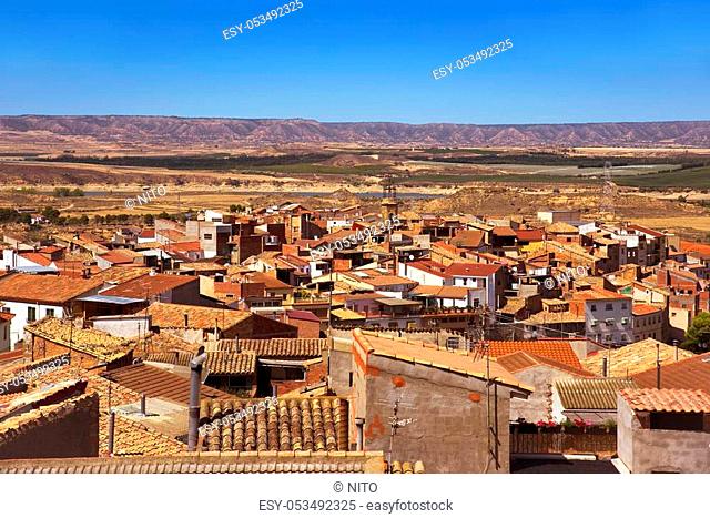 an aerial view of the roofs of the old town of Caspe, in Spain, highlighting the bell tower of the Colegiata de Santa Maria la Mayor