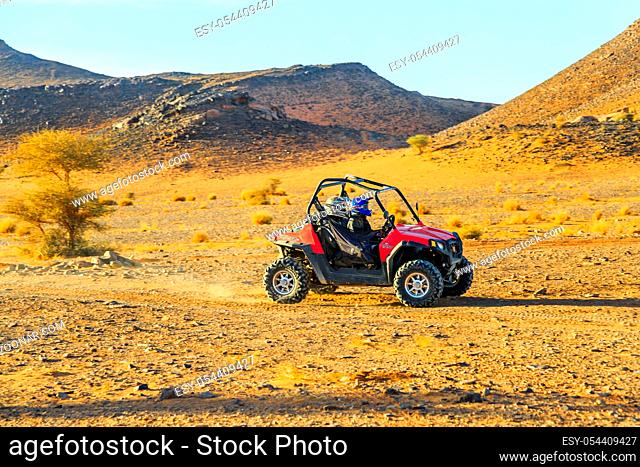 Ait Saoun, Morocco - February 23, 2016: Two people enjoying quad bike ride in Ait Saoun desert in Morocco