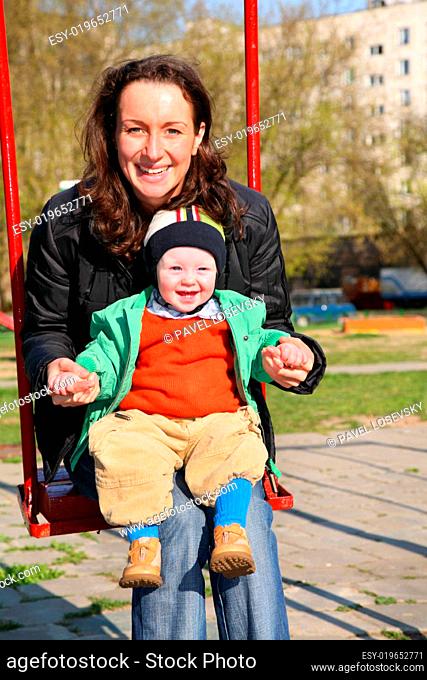 mother with baby on seesaw