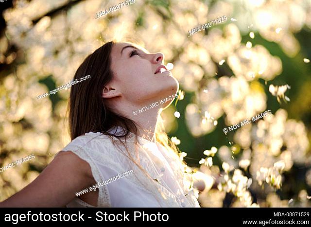 Portrait of a young woman with cherry blossoms