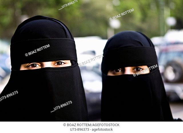 Arab women wearing traditional black Burka