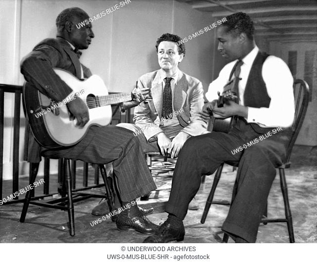 New York, New York: c. 1940.L-R: Leadbelly, Nicholas Ray, Josh White. .Ray became a film director; amongst his more notable films was Rebel Without A Cause