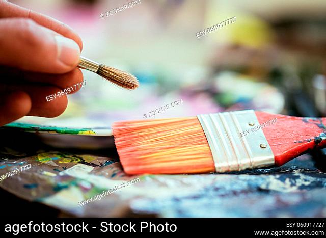 Artist paint brush on painting background. Painting therapy