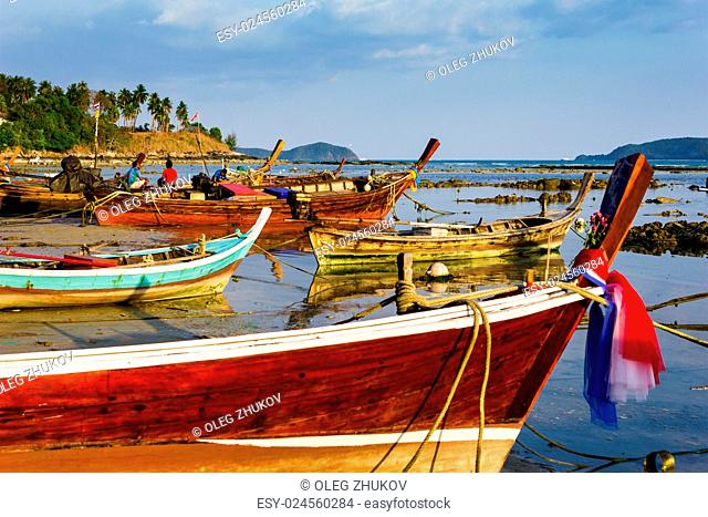 Fishing boats on the sea shore in Phuket, Thailand