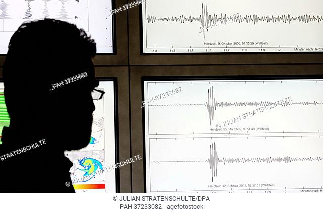 Geophysicist Gernot Hartmann sits in front of monitors showing the seismographic records of three nuclear tests in North Korea