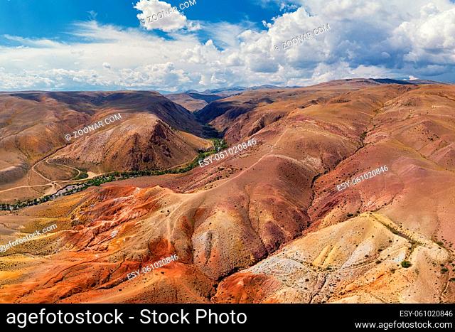 Aerial drone panorama of colorful eroded landform of Altai mountains with yellow, brown and red colors. Nature landscape in popular tourist location called Mars