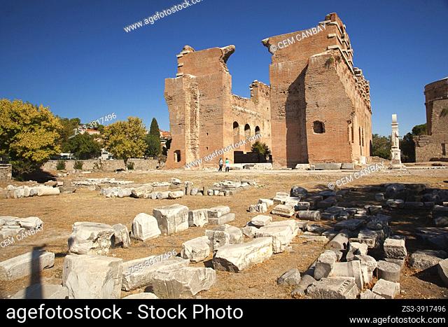 Tourists in front of the Red Basilica also called Red Hall and Red Courtyard, is a monumental ruined temple in the ancient city of Pergamon
