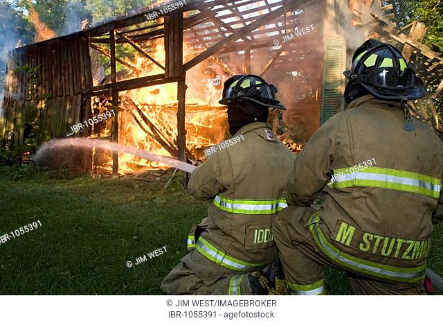 Members of the Shipshewana Volunteer Fire Department at a barn fire, Shipshewana, Indiana, USA