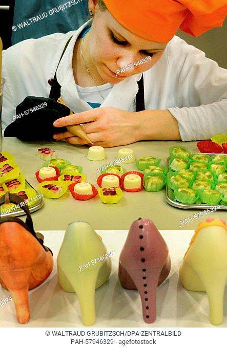 Master confectionist, Juliane Siedler, words on pralines and edible high heels in the display area of Karin Finger's Goethe Chocolate Factory in Oldisleben