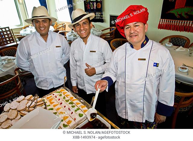 The Galley crew from the Lindblad Expedition ship National Geographic Endeavour prepare and serve a traditional Ecuadorian lunch in the Galapagos Islands