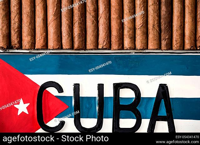 Cuban cigars and cuban flag, top view, flat lay