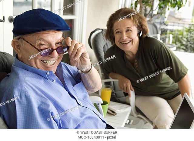 Senior couple relaxing on porch