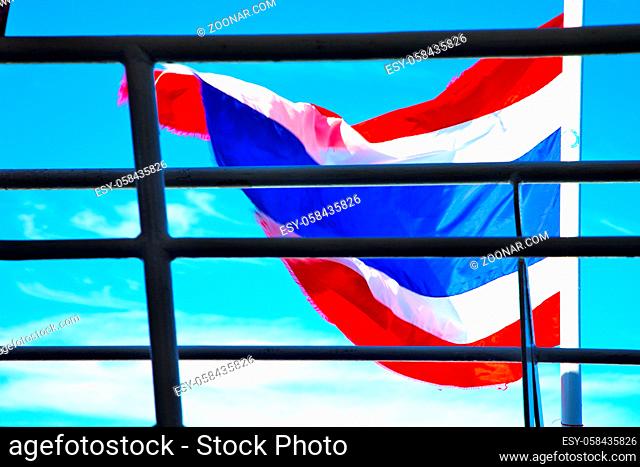 asia kho samui bay isle waving flag  in thailand and grate blue sky