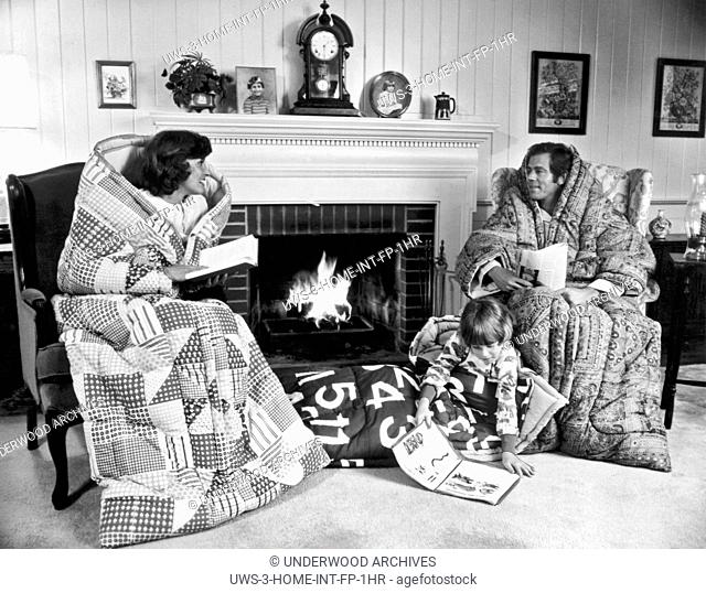 Detroit, Michigan: October 15, 1977.A family cozies up for the upcoming winter during the 1970's energy crisis with Snug Sacks