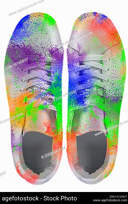 Sneakers covered in paint splashes. Colorful sneakers on a white background. Creative shoes