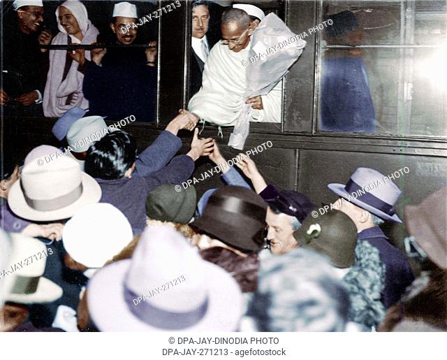 Mahatma Gandhi receiving farewell greeting at Lausanne station, Switzerland, December 11, 1931