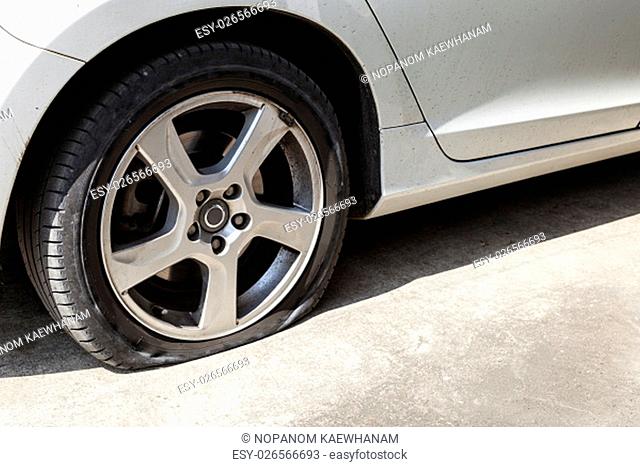 car wheel flat tire on the road