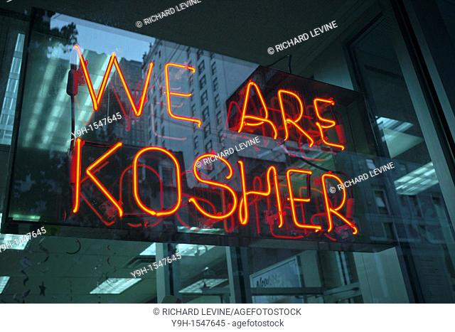A sign in the window of a Dunkin Donuts in New York advertises that they are kosher and observe dietary Jewish laws