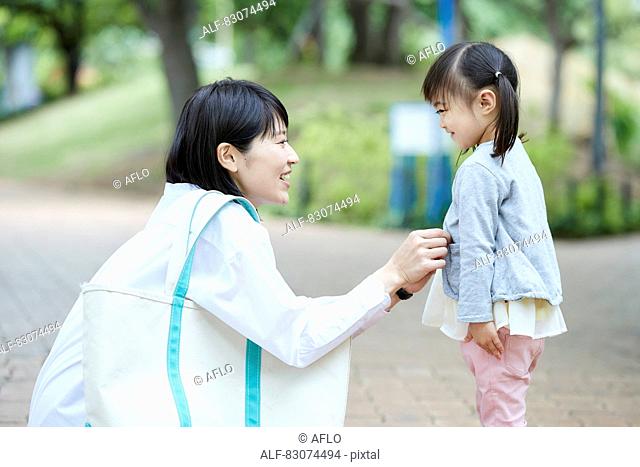 Japanese mother and daughter at a city park