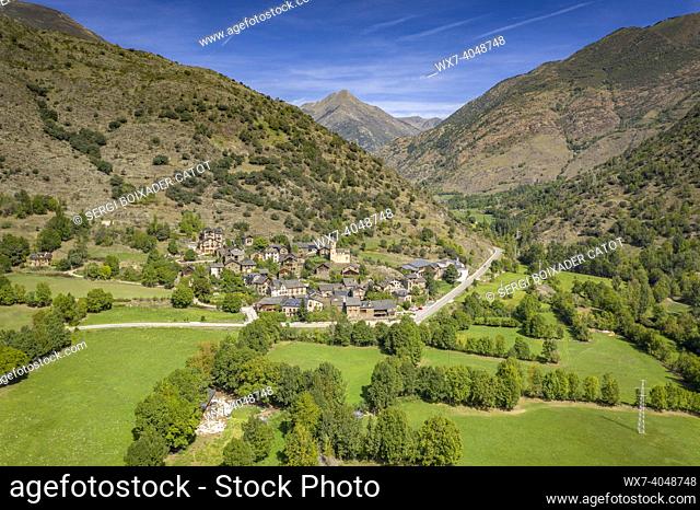 Aerial view of the town of Lladrós and the surrounding green fields, in the Cardós valley (Pallars SobirÃ , Lleida, Catalonia, Spain, Pyrenees)