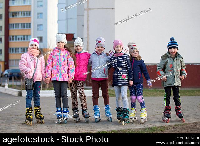 Belarus, Gomel city, April 04, 2019. Neighborhood area.A group of kids in roller skates on the street
