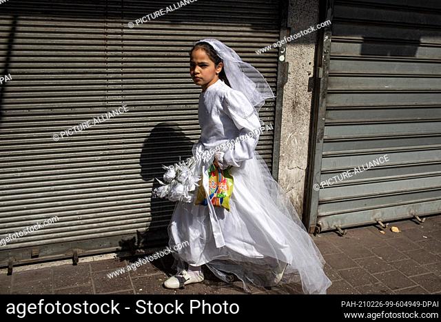 26 February 2021, Israel, Bnei Brak: A costumed Jewish girl takes part in celebrations marking Purim, also called the Festival of Lots