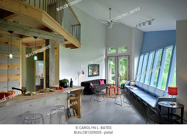 Split-level open plan living room and kitchen at home; Burlington; Vermont; USA