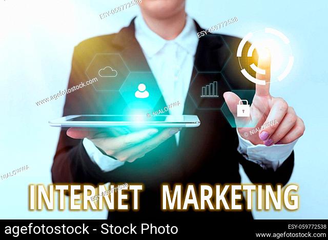 Text caption presenting Internet Marketing, Word Written on drive direct sales of products via electronic commerce Woman In Suit Holding Tablet Pointing Finger...