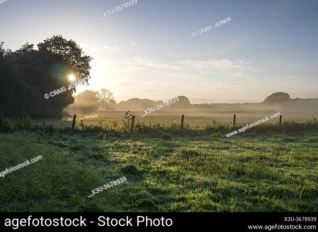 A misty autumnal morning sunrise over the North Somerset countryside near Wrington, England