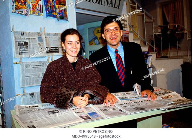Italian TV host Fabrizio Frizzi and Italian actress Sabina Guzzanti smiling in the studios of the TV show I fatti vostri. 1990