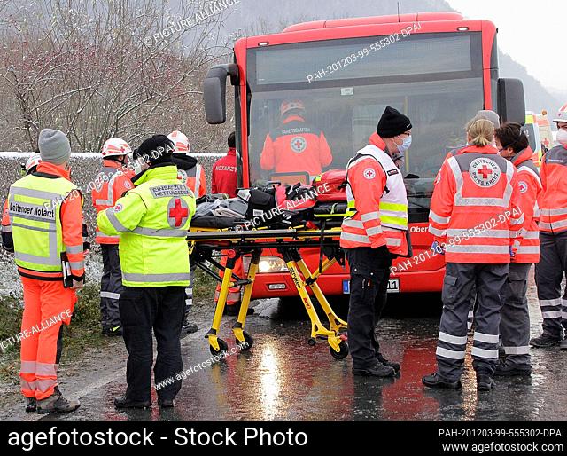 03 December 2020, Bavaria, Grassau: Rescue workers are at the scene of an accident. Several children have been injured in a school bus accident in Upper Bavaria
