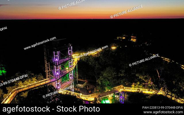 12 August 2022, Brandenburg, Beelitz-Heilstätten: The drone shot shows the light installations for the ""Long Nights at the Treetop Trail"" campaign in...