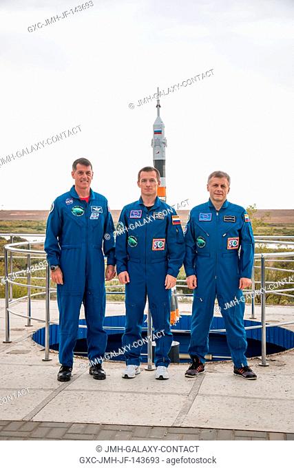 Expedition 49 flight engineer Shane Kimbrough of NASA, left, Soyuz commander Sergey Ryzhikov of Roscosmos, center, and flight engineer Andrey Borisenko of...