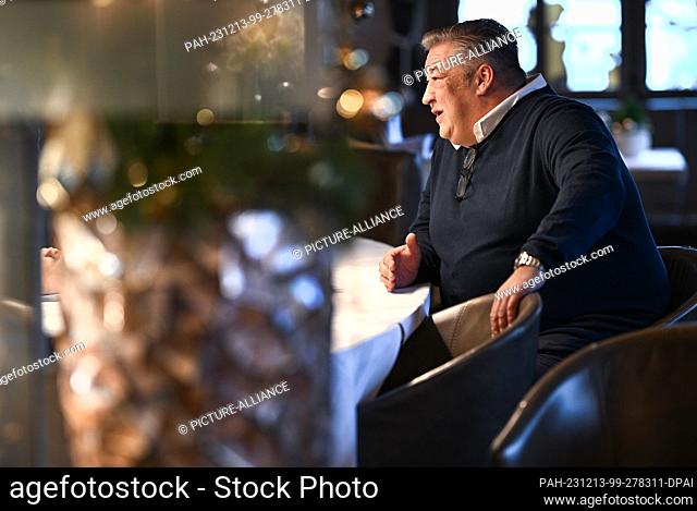 12 December 2023, Baden-Württemberg, Immenstaad am Bodensee: Michael Heinzler from Hotel and Restaurant Heinzler am See sits at the table during an interview...