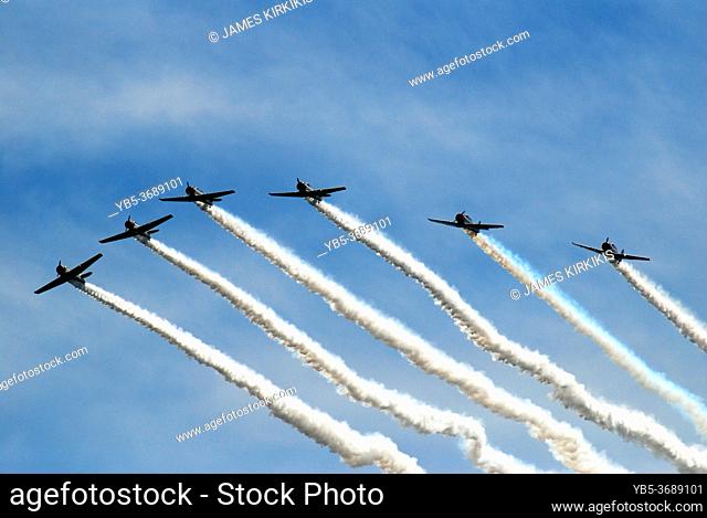 Stunt [pilots begin veering out of formation as they perform in an airshow