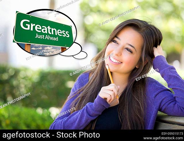 Pensive Young Woman with Thought Bubble of Greatness Just Ahead Green Road Sign
