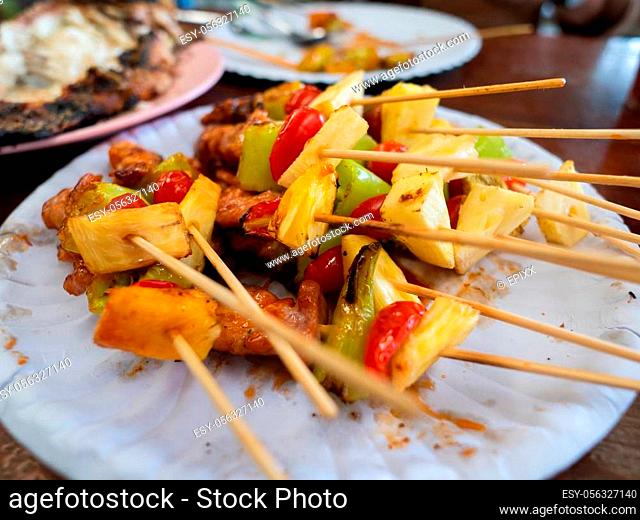 Chicken, tomato, pineapple and chili pepper on a stick can be found almost anywhere in Thailand on street barbecues. Many Thai people call this shish kebab or...