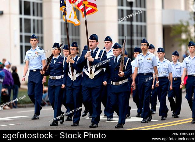 Wilmington, North Carolina, USA - April 6, 2019: The North Carolina Azalea Festival, Members of the Civil Air Patrol, marching, carrying the American Flag