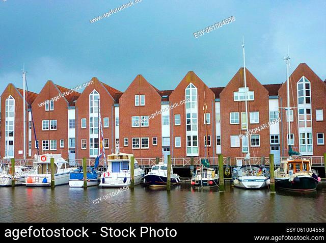 The port of Husum with boats and brick houses