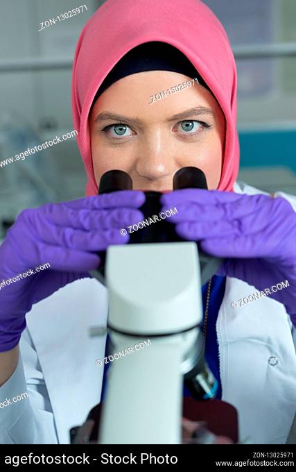 muslim lab worker doing an analysis