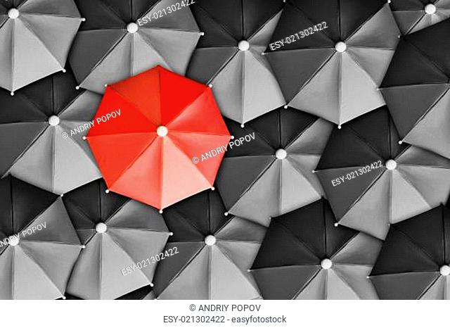 Red Umbrella Surrounded By Black Ones